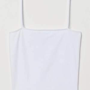 En vit ny linne från H&M i storlek S. 