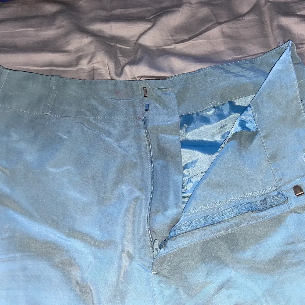 Turquoise trousers in the size L/XL, Second hand bought . Jeans & Byxor.