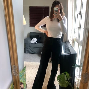 Guess pants black  - It’s an older pair of flared Guess pants in 70s style. Worn very rarely because it is a bit too big for me. Probably size M/38