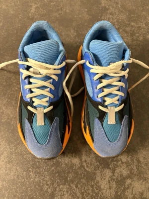 Adidas Yeezy boost 700 bright blue  - Grab these cool Yeezy Boost Bright Blue! 🚨 Model: Yeezy Boost Bright Blue Color: Blue/Orange Size: 40 2/3 Fit: True to size The shoes are almost like new and come with the original box.