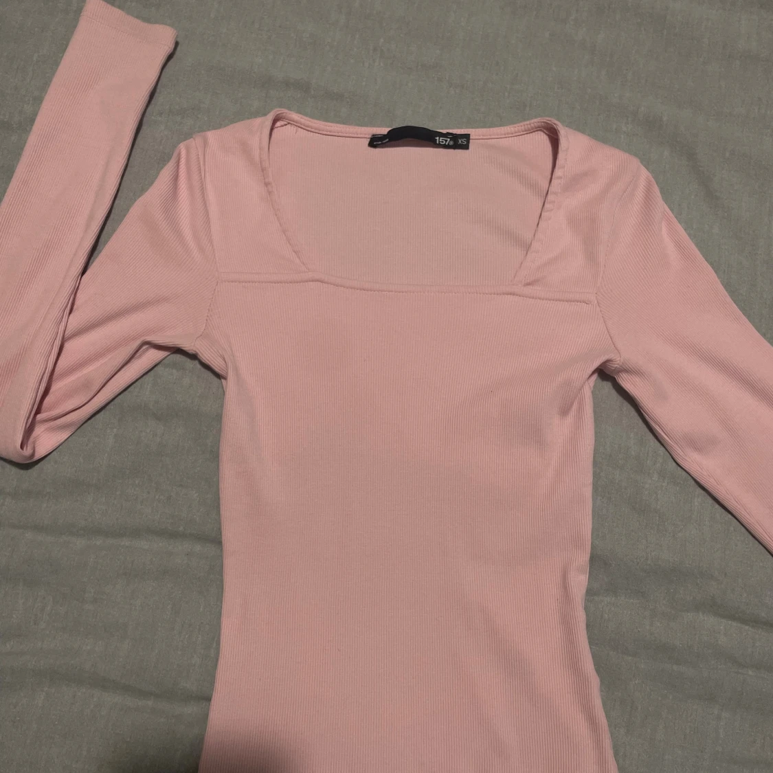 Ljusrosa ribbad långärmad topp XS