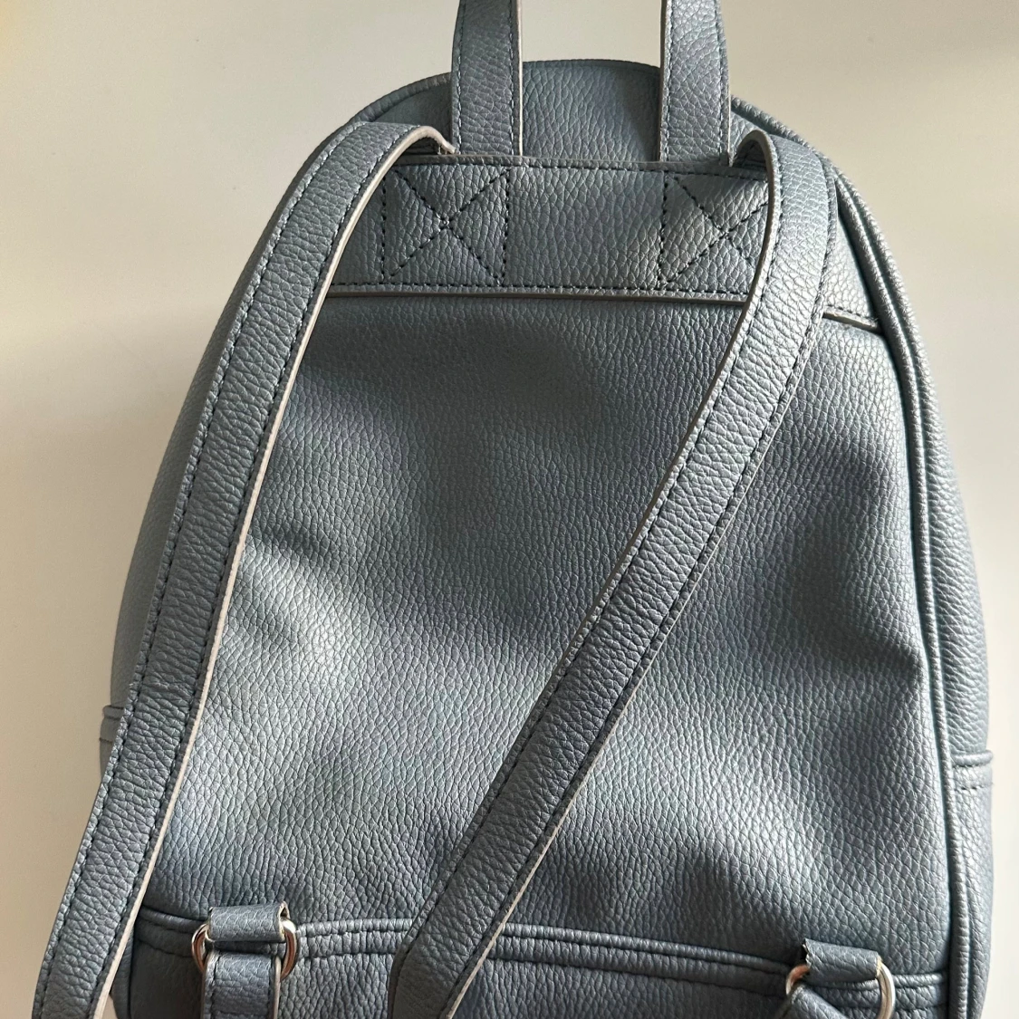 Ljusblå ryggsäck  - 1