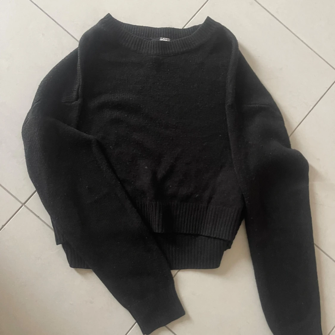 Svart stickad tröja