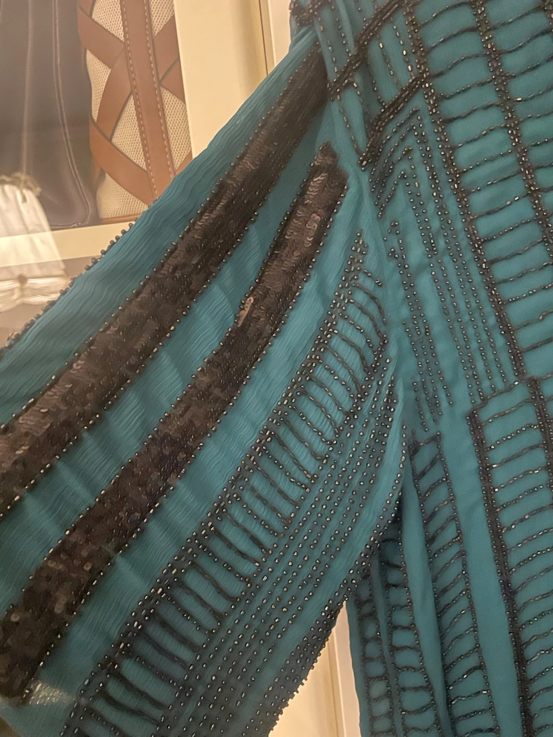 Turkos blus med paljettdetaljer från H&M - 1