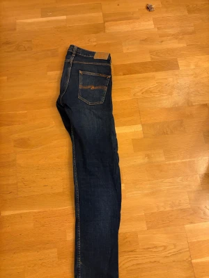 NUDIE GRIM TIM - Säljer mina näst intill oanvända nudie grim Tim jeans då de ej kommer till användning längre storlek 31/32!