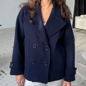 Kappa designbysi  - super fin kappa ifrån Design By Si, säljer då jag inte använder den längre! bra skick. storlek XS/S. originalpris 757kr, säljer för 399kr!