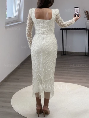 Vit långklänning med pärldetaljer - Supersnygg vit långklänning från MISSACC med pärlbroderade detaljer över hela klänningen. Den har långärmade transparenta ärmar, fyrkantig urringning och figurnära passform. Perfekt för dig som vill sticka ut med en elegant look.