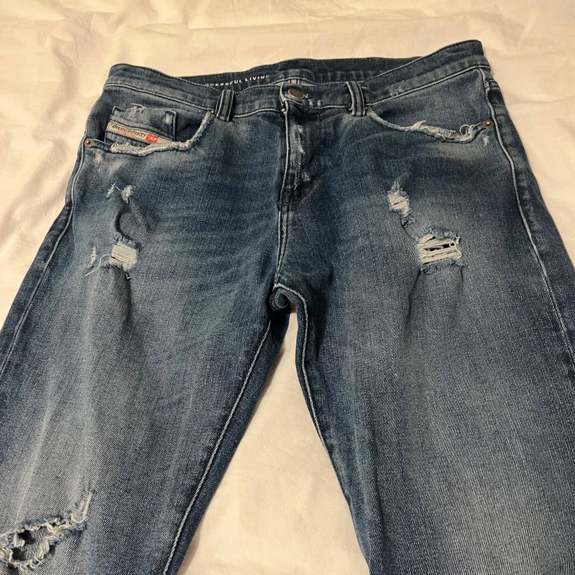 Blå slitna jeans från Diesel W31 L32 - 1