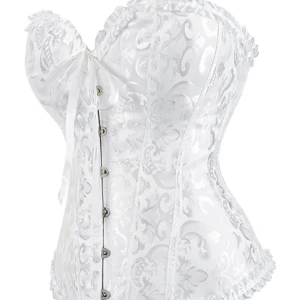 Vit korsett med satinrosett och spets - Snygg vit korsett med glansigt, brokadliknande mönster och dekorativa volangkanter. Framsidan har metallknäppning och en söt satinrosett, medan baksidan har snörning för perfekt passform. Materialet är satinliknande och ger en lyxig känsla. (Lånade bilder från före detta  ägare, jag har använt den en gång) 