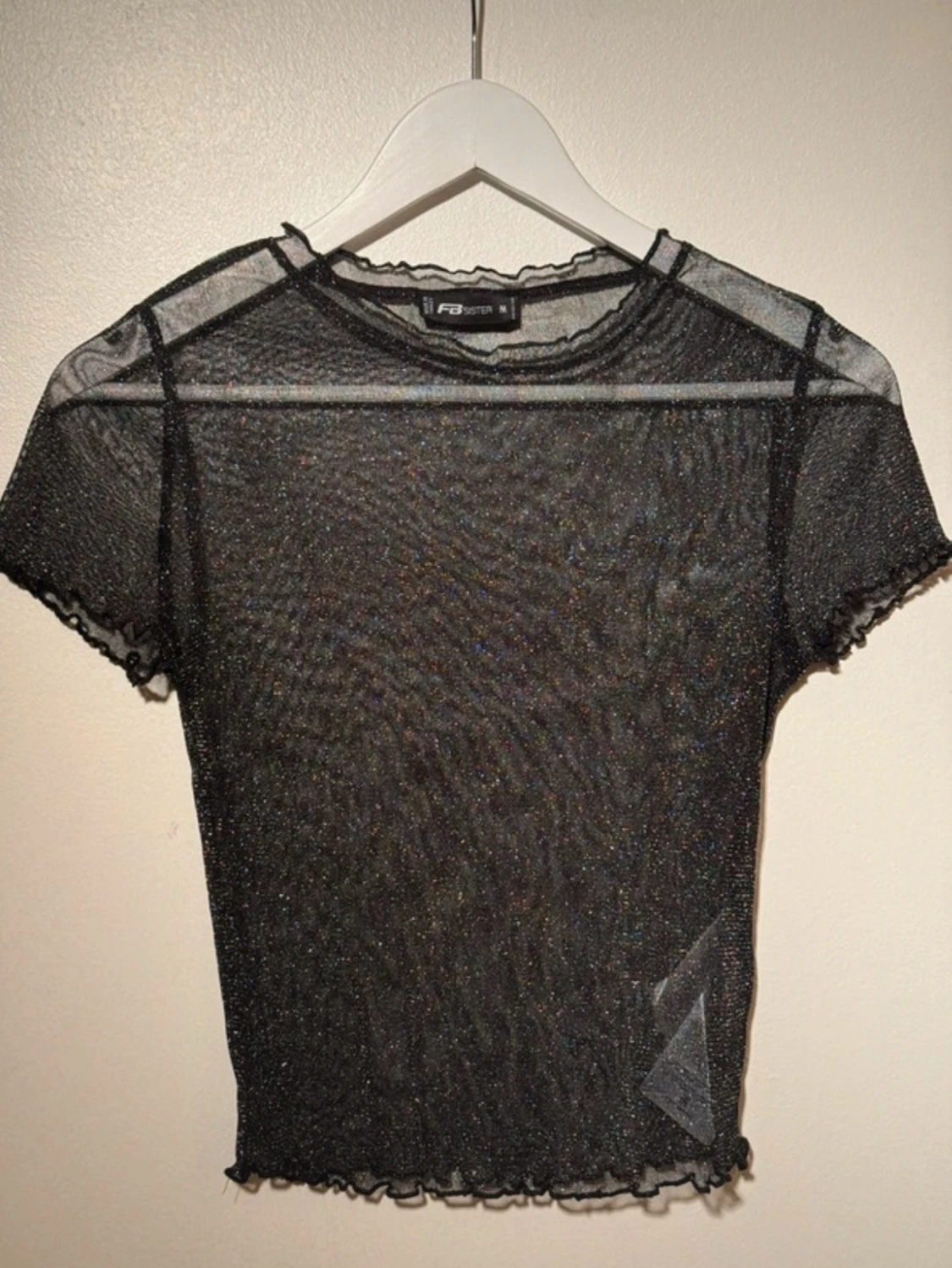 Glittrig mesh topp från F.A. Sister