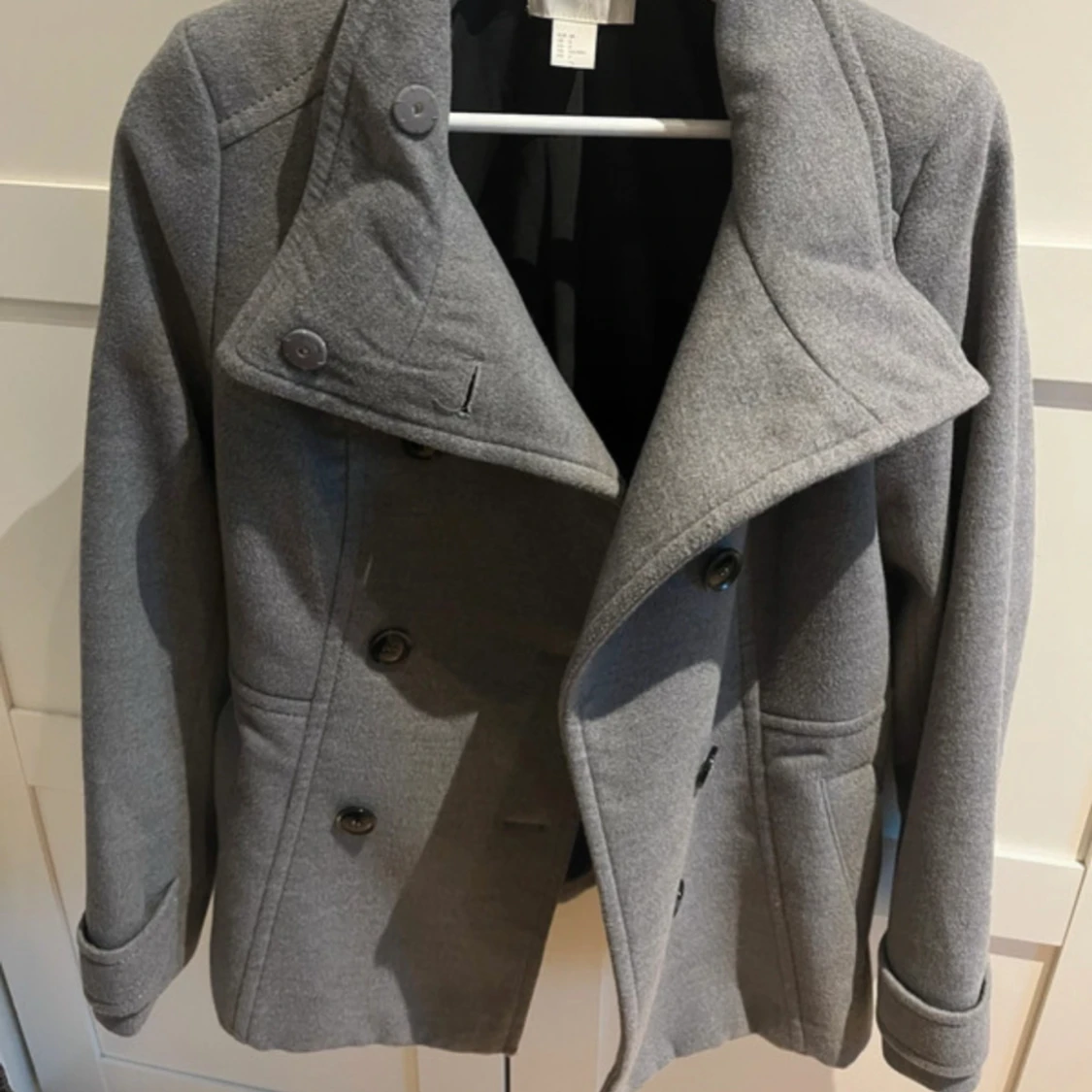 Kappa med hög krage 