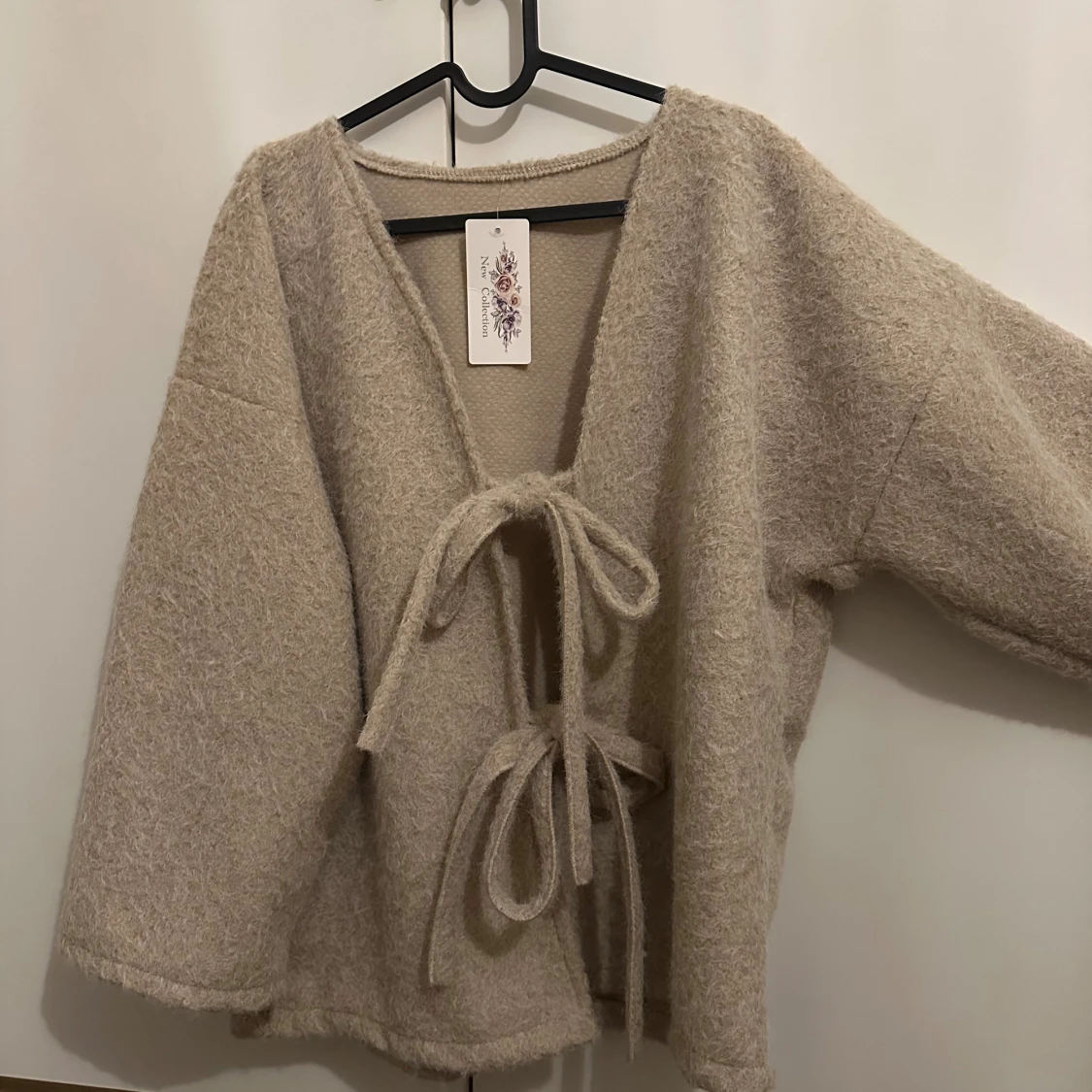 Beige omlottkofta från frankrike