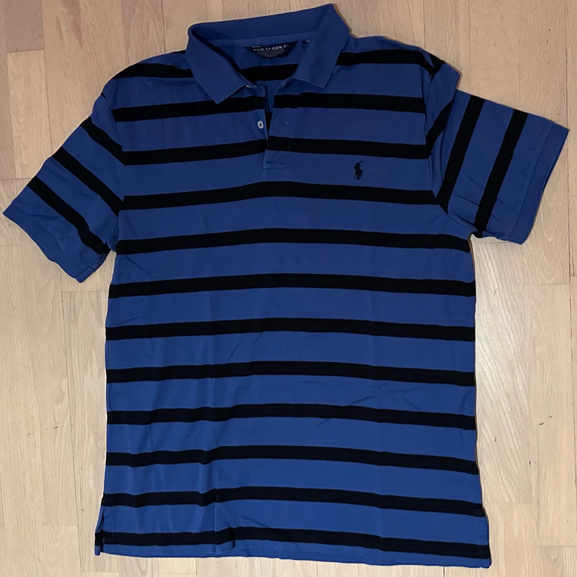 Blå och svart randig pikétröja Polo Golf - 1