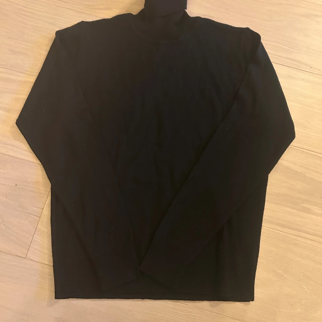 Svart polotröja från Paul & Friends