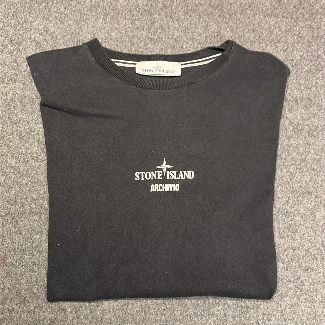 Svart Stone Island t-shirt med tryck