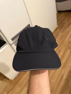 Haglöfs Keps M/L i mycket bra skick - Haglövs Keps i M/L storlek i nyskick
