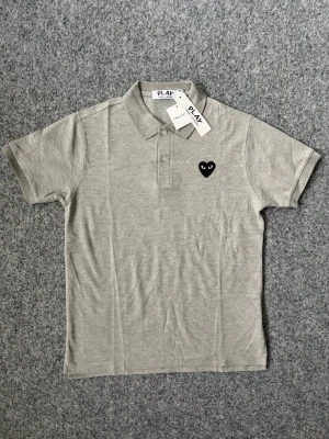 CDG gray polo shirt - size M, true to size