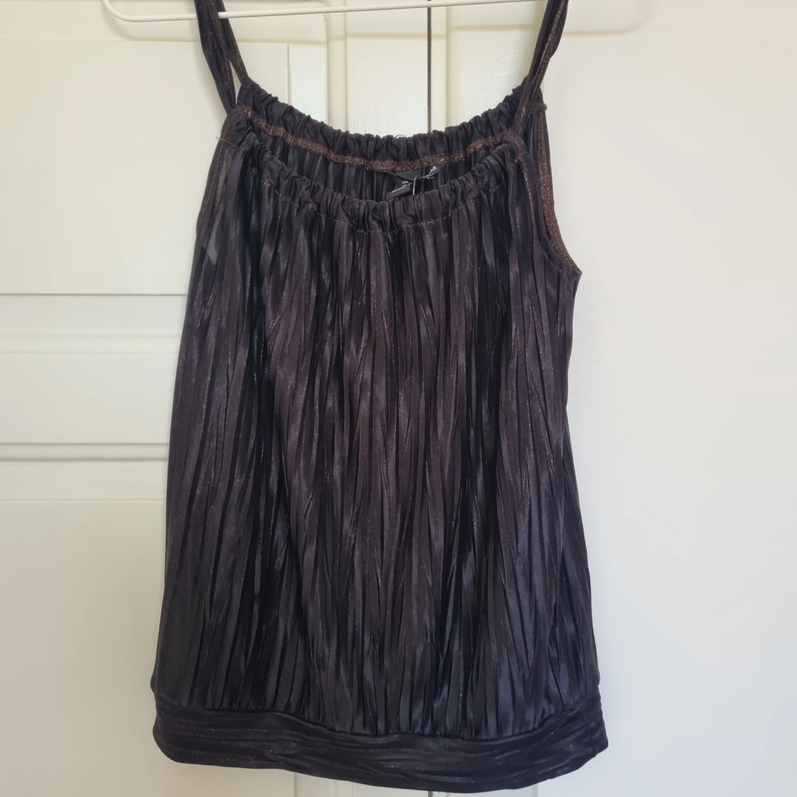 Svart glittrigt linne 