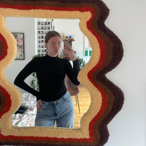 Svart polotröja  - Svart polotröja, är i tunnt material