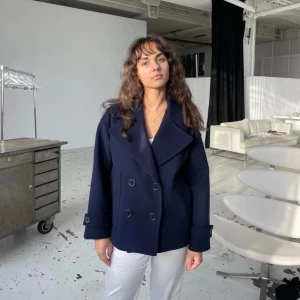 Kappa - En design by si kappa i storlek M/L. Knappt använd