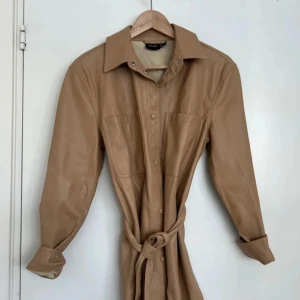 Trench coat - With the material so soft in the inside and so leather at the outside, it’s not heavy, and it’s really comfortable.