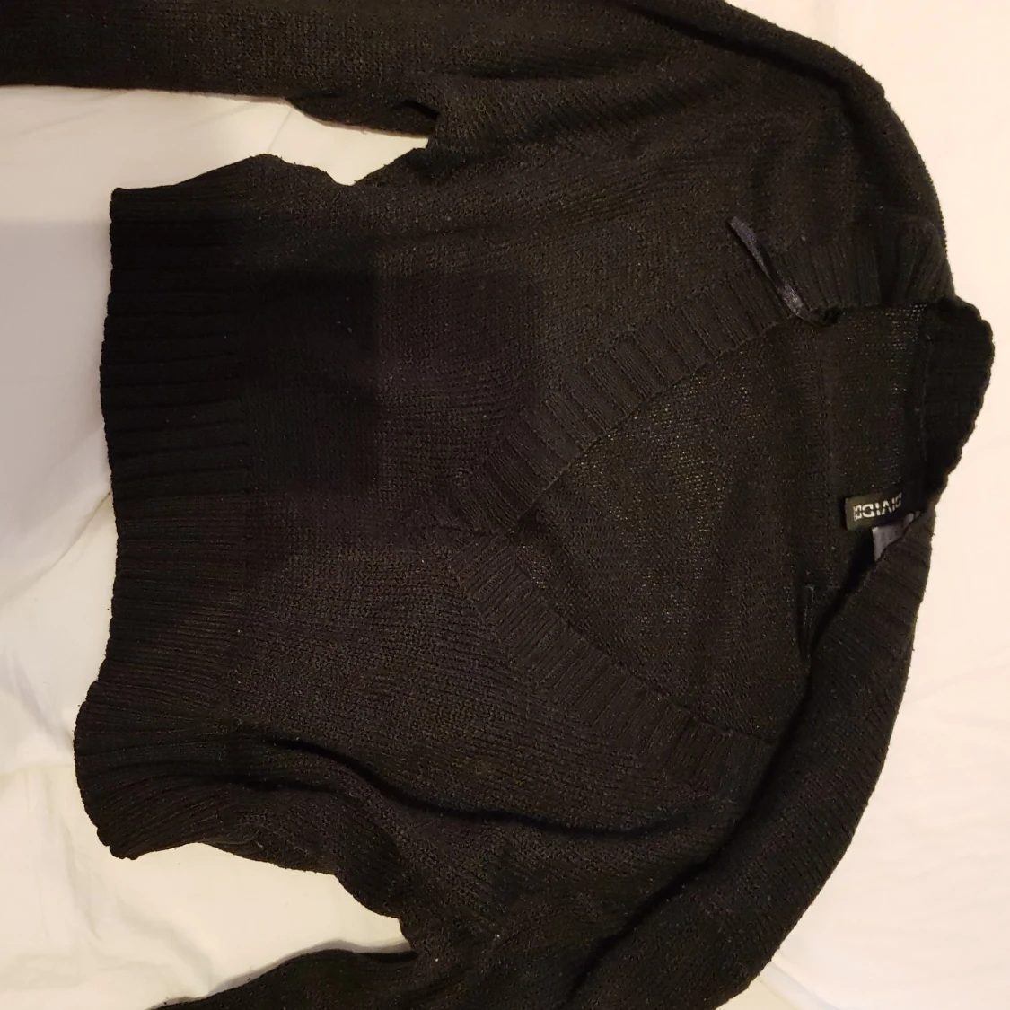 V ringad stickad tröja