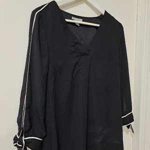 Klänning  - Storlek 34