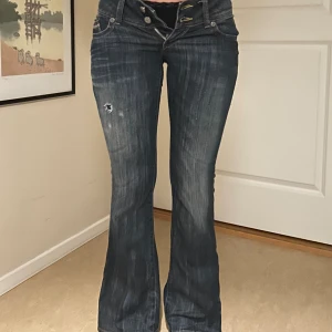 Håliga jeans - Håliga/slitna jeans Lågmidjade bootcut.