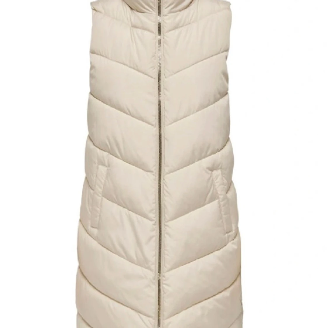 Lång väst som är bekväm inga hål eller liknande 