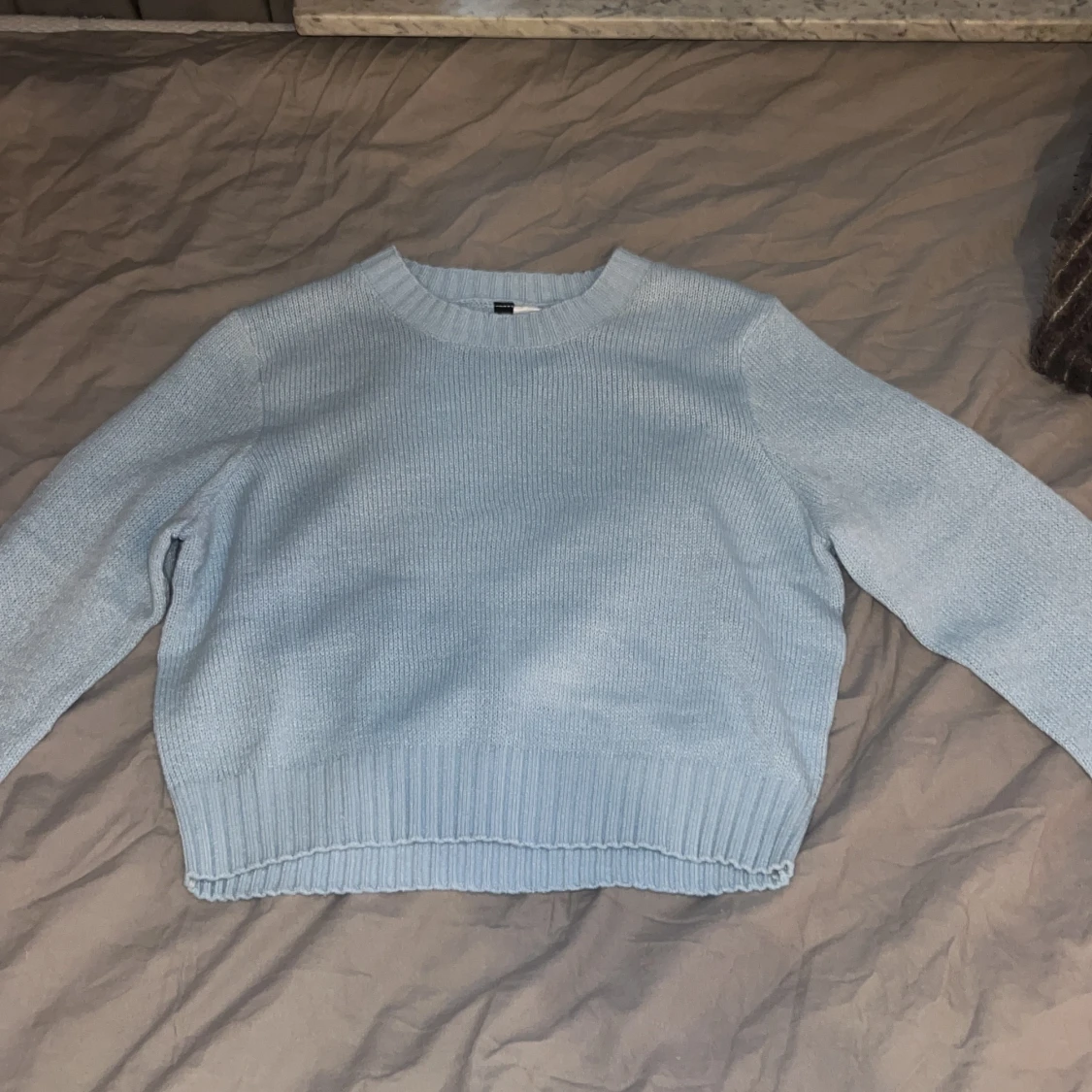 Blå stickad tröja