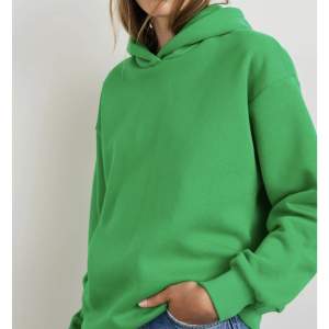Oanvänd grön hoodie från Gina Tricot
