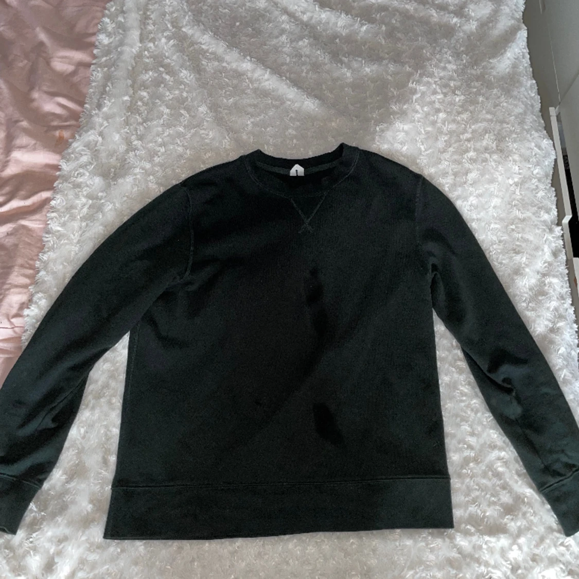 En mörkgrön tröja från arket 250:-