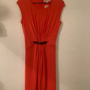 Michael Kors smart casual dress. Orange colour, fitted at waist, built in belt with gold buckle. Size S/Eu 36. New. Labels attached. 