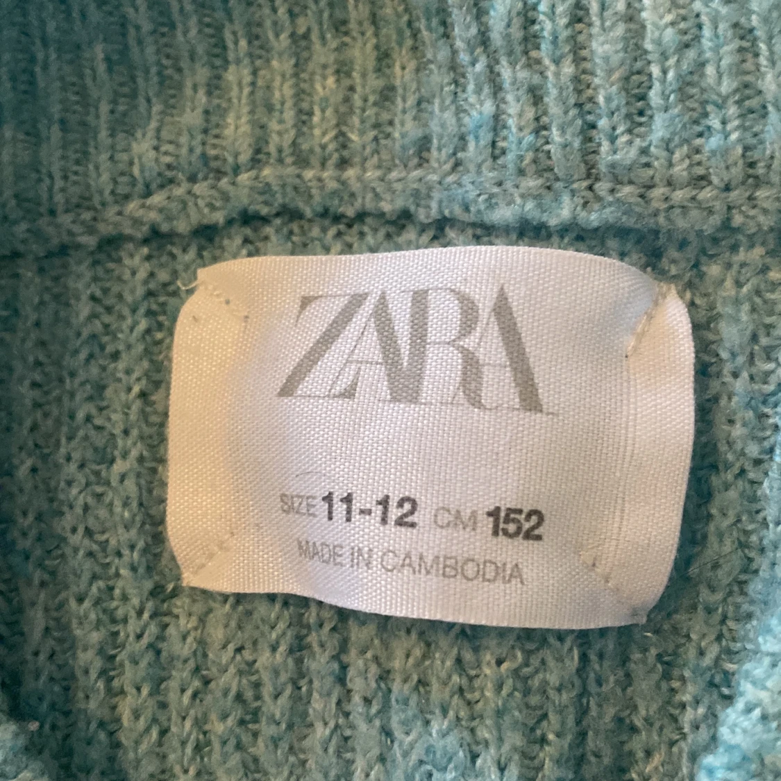 Turkos stickad tröja  - 90