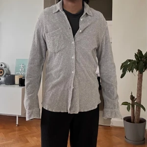 Our Legacy Terry Towel Shirt - Our Legacy Terry Towel Shirt  Size 46 mid-weight cotton Terry towelling fabric, the long sleeve shirt comprises a point collar, pearl button front placket and a tonal chest patch pocket