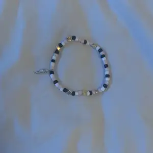 Starlight bracelet with feather (FEATHER IS RARE BECAUSE ITS MY FIRST ITEM IM SELLING!)