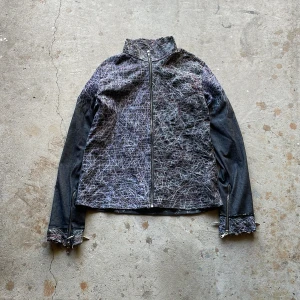Distressed Denim Jacket - Crafted from scratch this jacket features denim, spike and distressing.