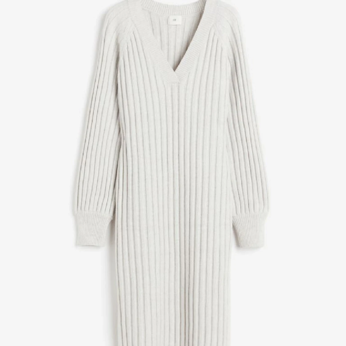 Ribbstickad klänning 