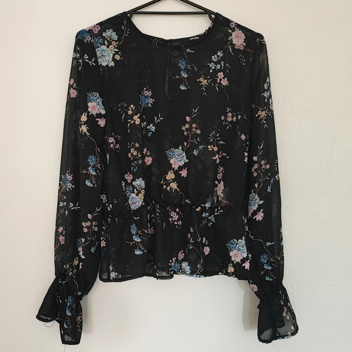 Blommig peplumtopp stl M - 90