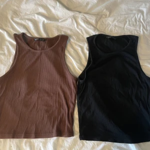 Svart och brunt linne - Ett svart och ett brunt linne. Fint skick! 20 kr för en och 30 kr för båda