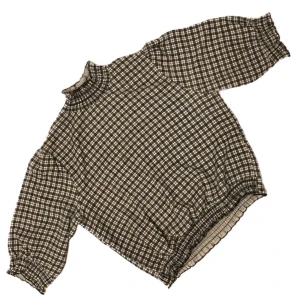 Smårutig blus - Blus från Monki i stretchigt polyestertyg. Aldrig använd av mig. Storlek M men passar mindre. 