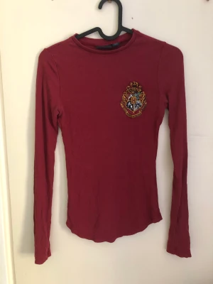 Harry Potter Gryffindor shirt - Red Gryffindor long sleeve shirt bought at warner bros studios, london