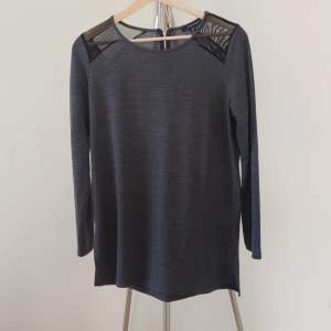 Gray rocky feeling blouse with zipper and black see-through shoulders