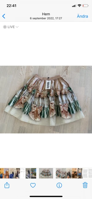 MOLO festkjol  - Underbar kjol från MOLO Mönster av stora rosetter Guldresår i linningen  Vid modell  Oanvänd med etiketten kvar 