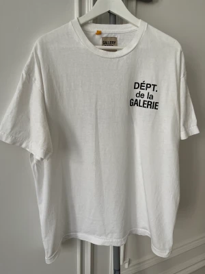 Gallery Dept. French Logo Tee - Gallery Dept. French Logo Tee  Size Large Fairly used with some small holes. Please see pictures as a reference.  Comes with original receipt and everything that came with the original purchase.