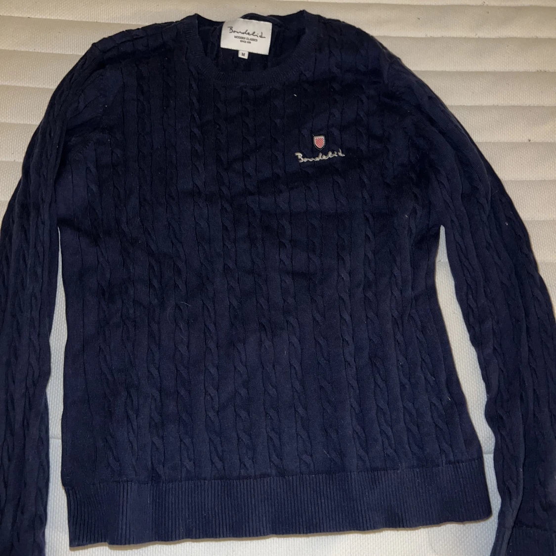 Bondelid kabelstickad Storlek M