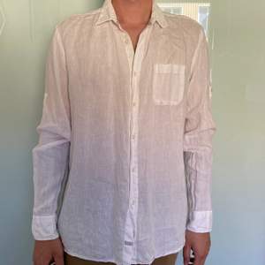 A white linen shirt very comfortable, not oftenly worn, very good condition.