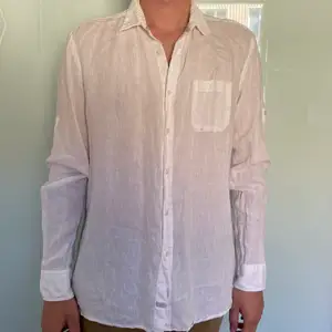 A white linen shirt very comfortable, not oftenly worn, very good condition.