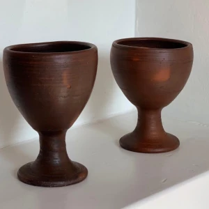 Handmade Chilean Clay Cups - Handmade Chilean Clay Suit Of Cups.  Set Of 2 Produced in Wood Burning Kilns without Glaze leaving an Earthly Matte Finish. Pre-Cured Hand Wash with Warm Water and Soap Made in Chile  12 cm (4.7 in) Length 9 cm (3.5 in) Width