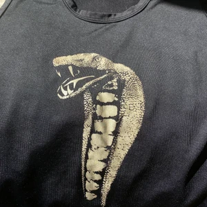 Sleeveless T-shirt - inte min stil, passar M/L toppskick